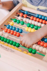 playing with beads develops fine motor skills